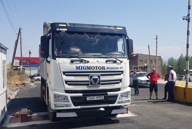 Truck drivers block one of the traffic lanes of the Yerevan-Meghri road. the reason is highway 
weight station