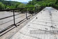 Four pedestrian bridges built in disaster zone, car bridge under construction